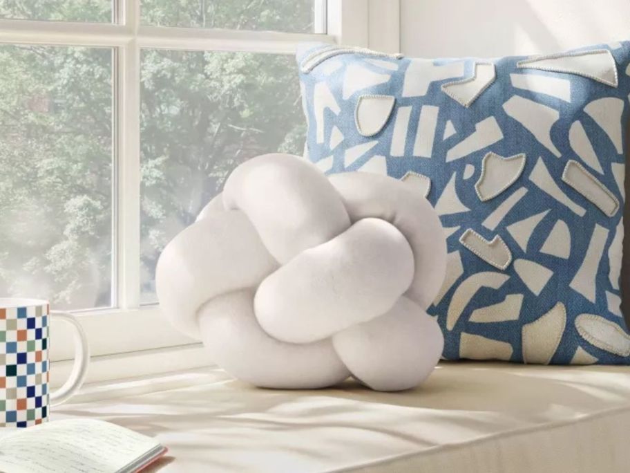 Room Essentials Shaped Knot Pillow in Ivory on bench