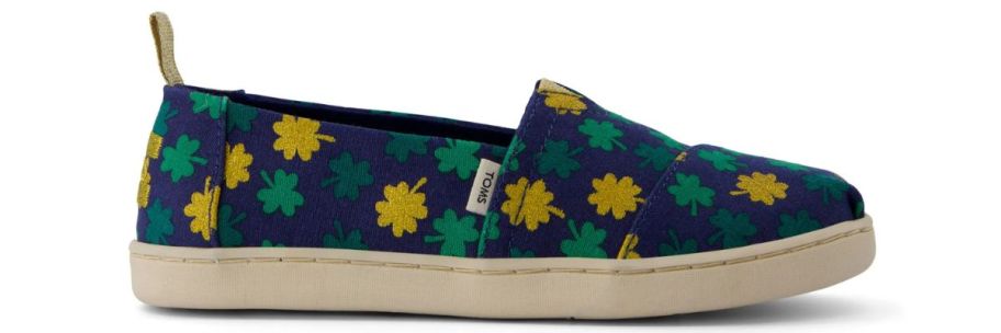 A canvas shoe with shamrocks on it