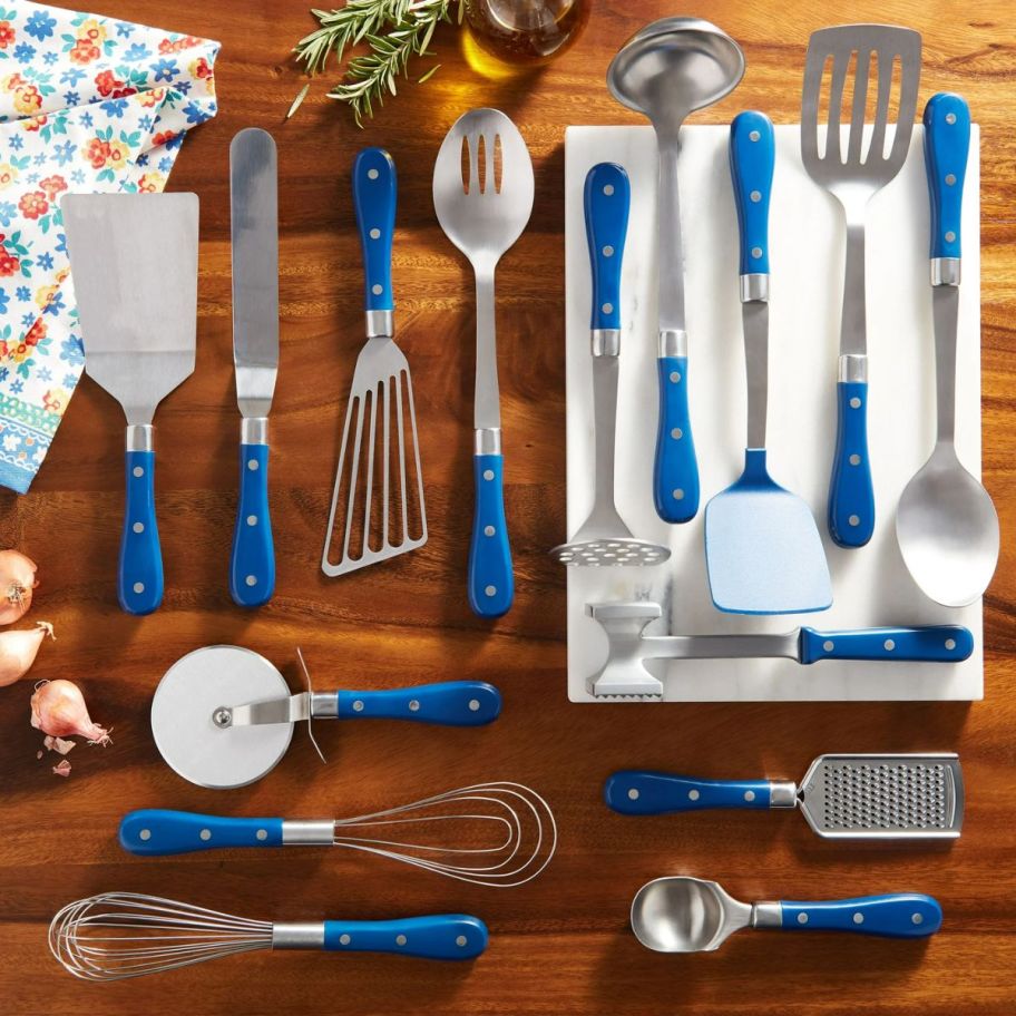 a 15 piece kitchen gadget and utensil set arranged on a counter top