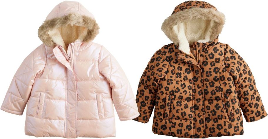 two baby girls heavy weight parkas stock images