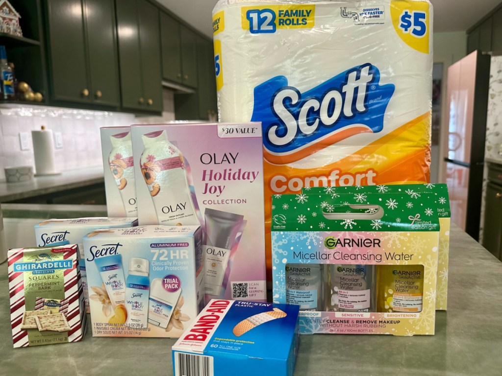 Kitchen counter with Ghirardelli chocolates, beauty gift sets, Band-Aids, and Scott toilet paper