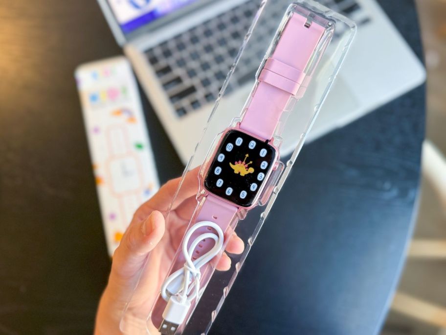 Someone holding a pink ZUODUN Kids Smartwatch