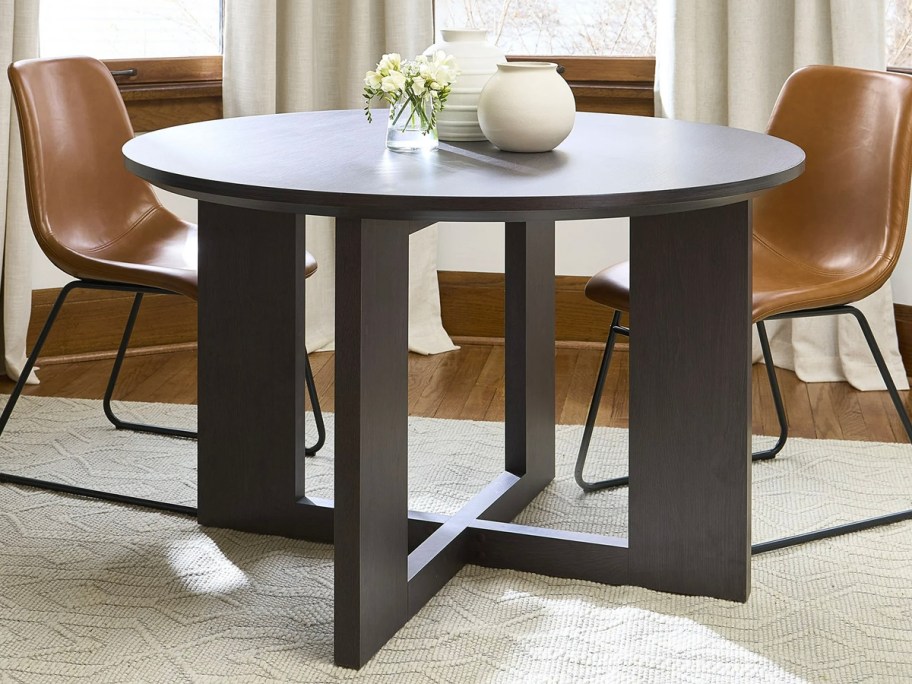 dark brown steele table with brown chairs 