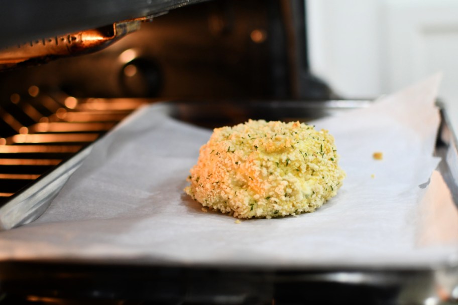 boursin cheese on a sheet pan after baking