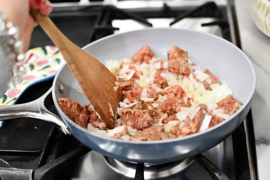 browning sausage and onions in a skillet 