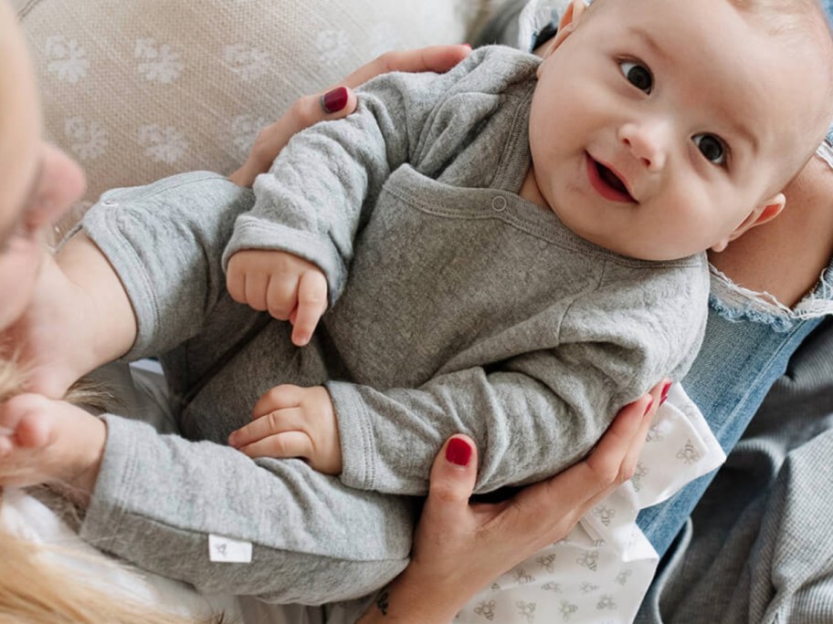 baby in grey wrap