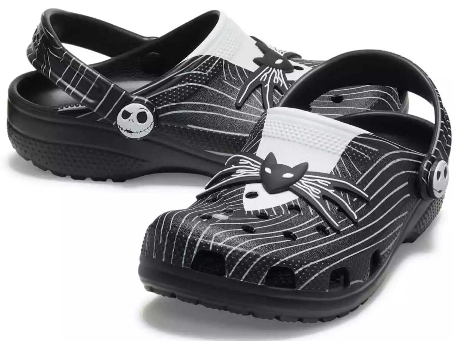 a pair of black and white Crocs clogs shoes that look like Jack's tuxedo from Nightmare Before Christmas