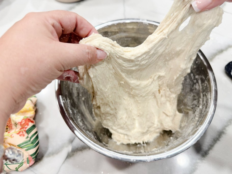 doing stretch and folds inside a mixing bowl 