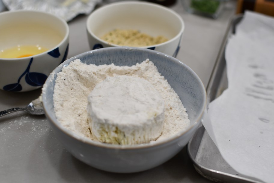 drudging boursin cheese in flour