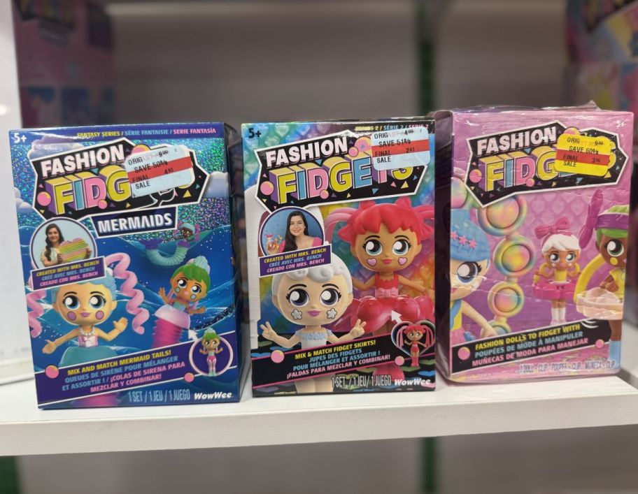 3 fidget toy packs on a store shelf 