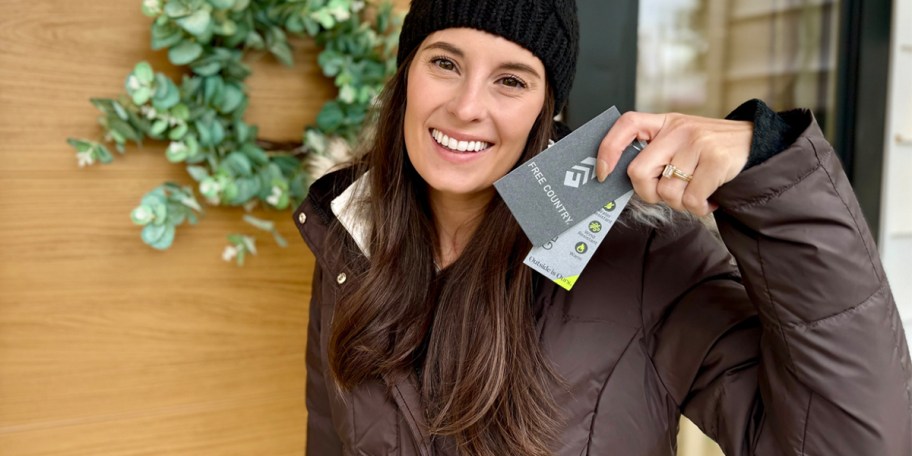 woman wearing black beanie and brown jacket