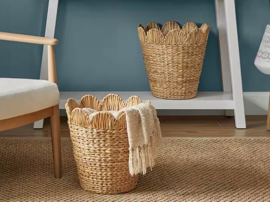 scalloped wicker baskets with blanket inside 