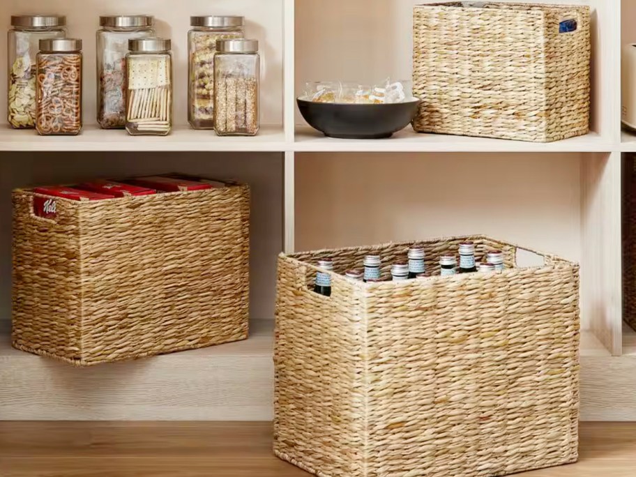 wicker baskets in pantry full of foods 