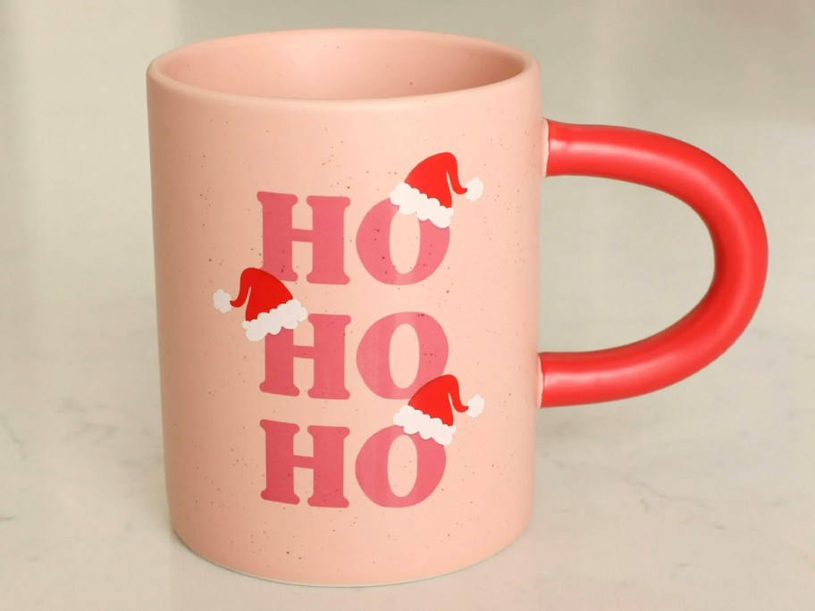 pink mug with ho ho ho on it 