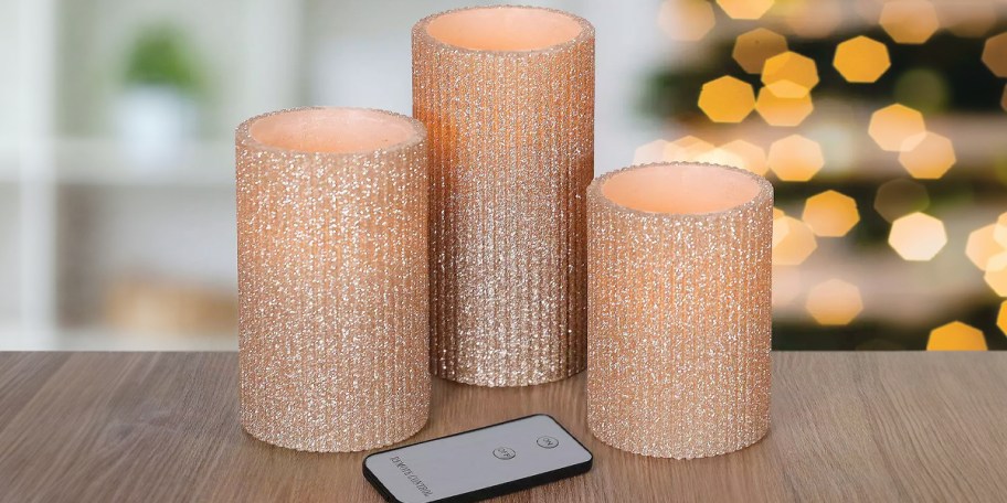 glitter 3-piece candle set on table with remote