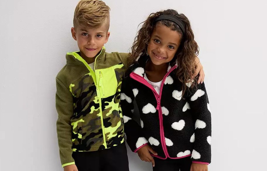 a boy and girl wearing kohls kids fleece jackets