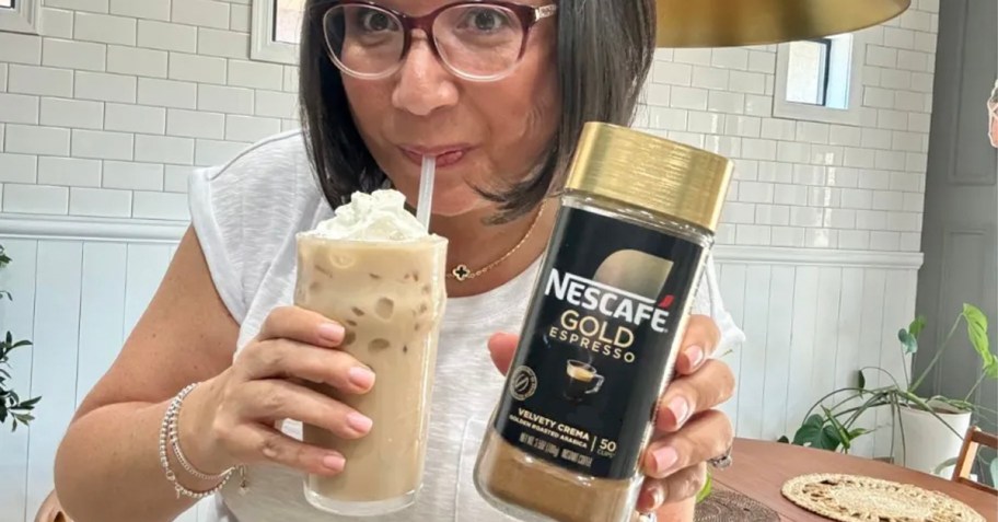 woman holding nescafe coffee and drink 