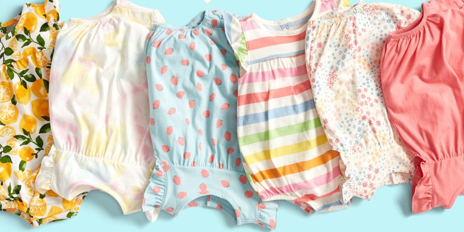 5 multicolored onesies on blue background