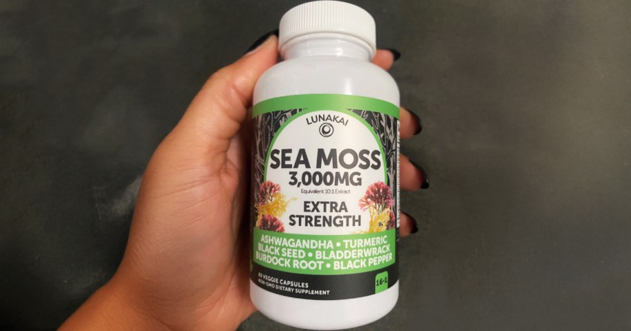 hand holding a bottle of lunakai sea moss