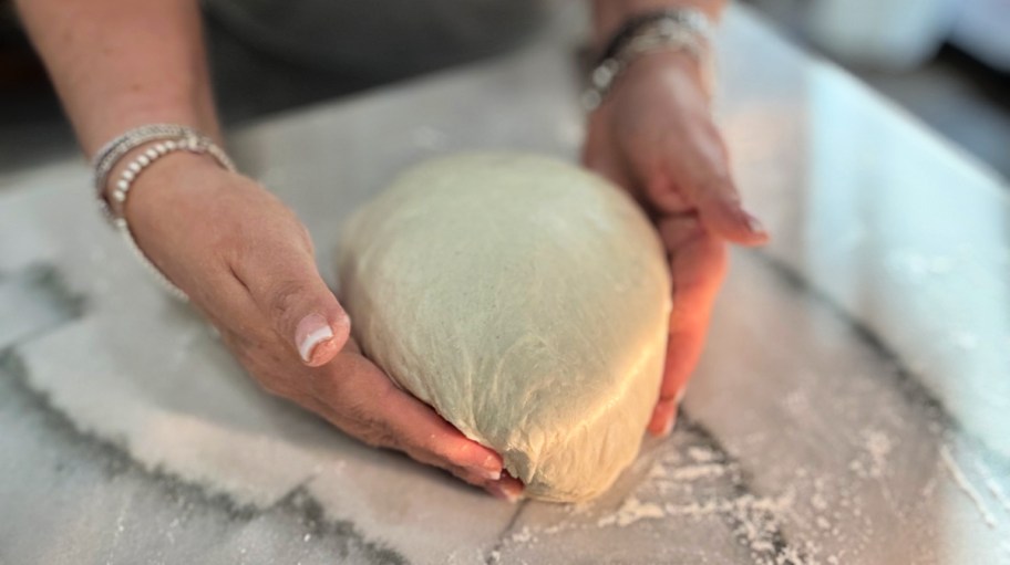 shaping a loaf of homemade bread