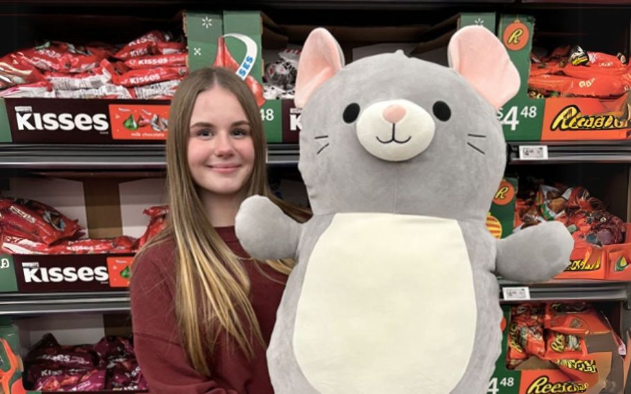 girl with 26 in squishmallows mouse