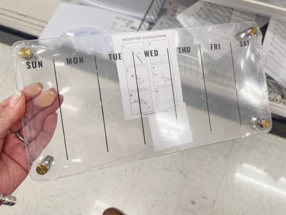 hand holding calendar board