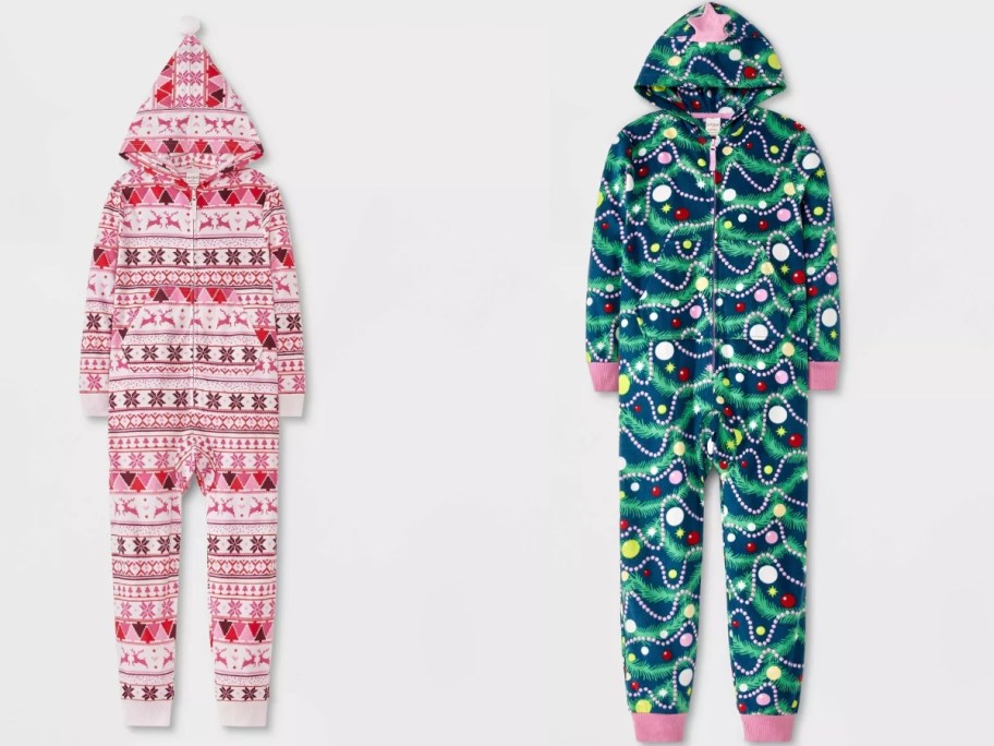 two girls one piece hooded union suit pajamas, one is red and pink with a Christmas fair isle print on it, the other is green with ornaments and Christmas lights