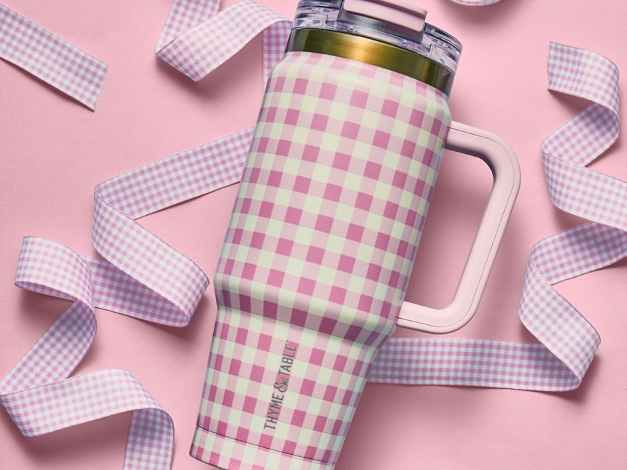 pink and white gingham tumbler laying with pink ribbon