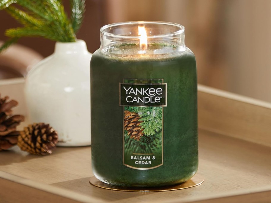 green balsam yankee candle on table