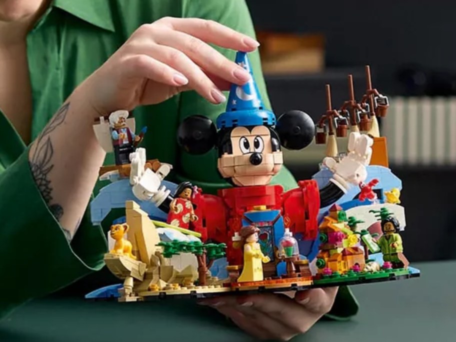 kid playing with a Disney Mickey Mouse LEGO set