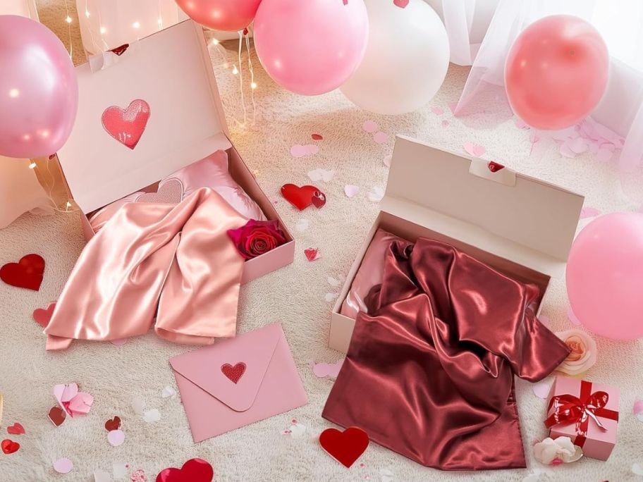 two boxes of Bedelite Satin Pillowcase surrounded by Valentine's Day decorations