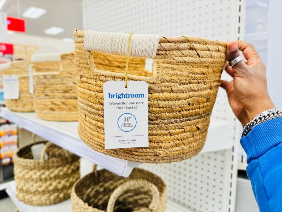 person taking Brightroom woven round basket from shelf