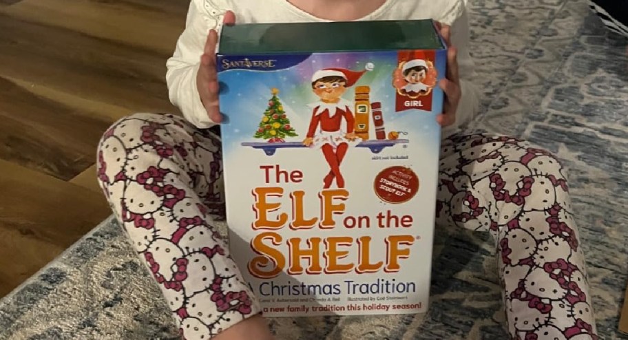 Child-holding-elf-on-the-shelf-book-set