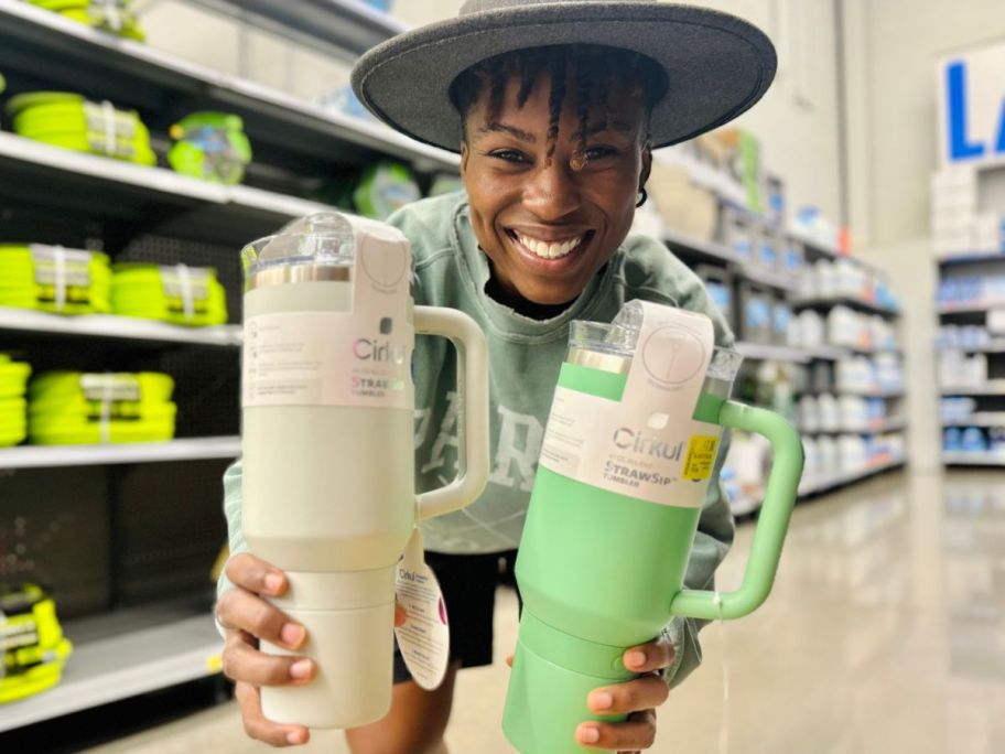 Woman holding two Cirkul tumblers