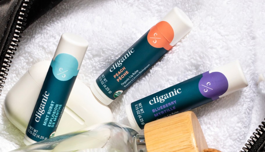 Three tubes of Cliganic Lip Balm on a towel