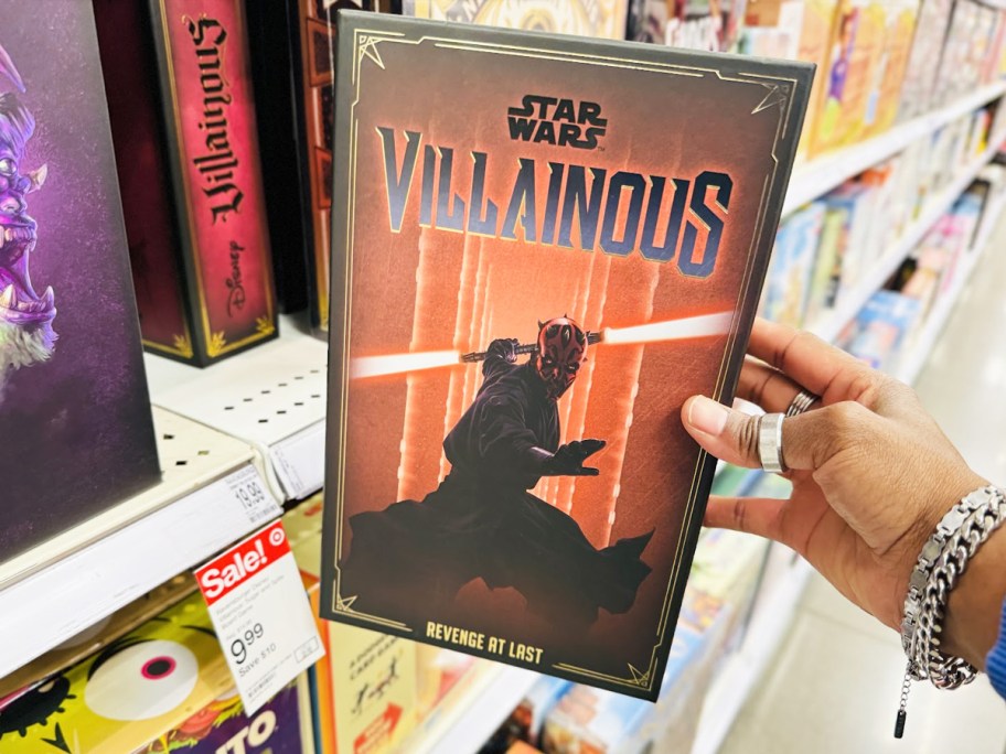 hand holding Disney Ravensburger Star Wars Villainous Revenge at Last Game in store