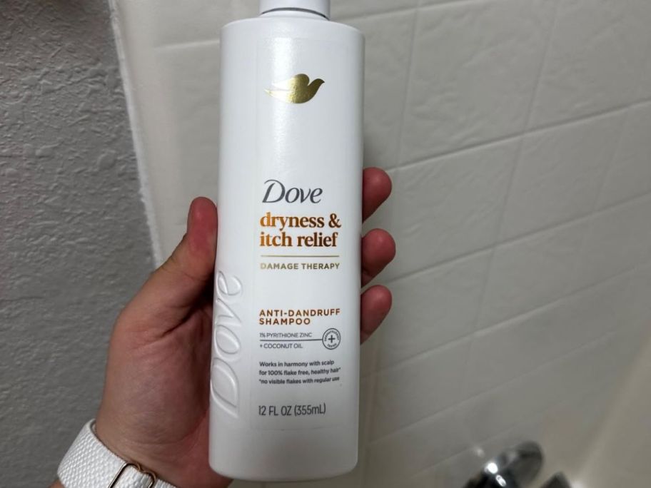 A person holding Dove Dryness & Itch Relief