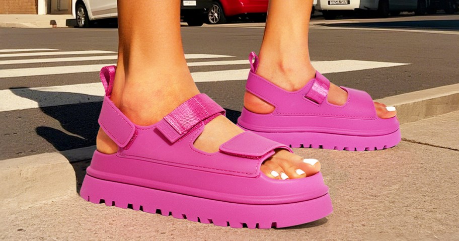 woman wearing pair of pink platform sandals