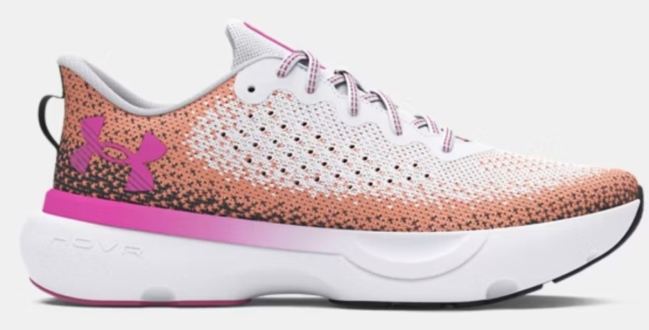 a women's Under Armour running shoe in white with pink, tan, and orange accents