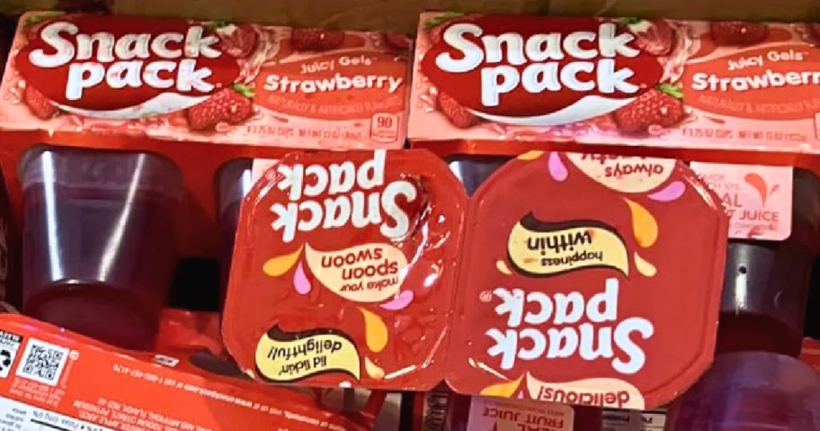 a box with several packs and individual strawberry flavor Snack Pack Juicy Gel snack cups