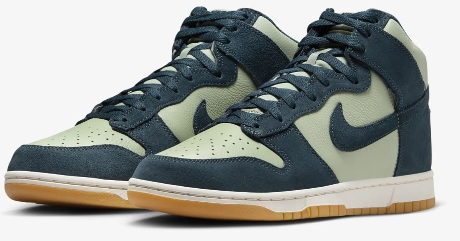 a pair of light green and dark green men's high top Nike Dunk sneakers