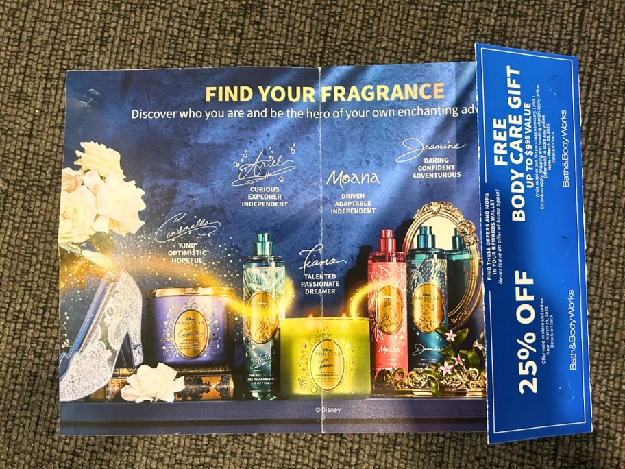 a blue Bath & Body Works mailer with images of Disney Princess Collection items and coupon on the flap