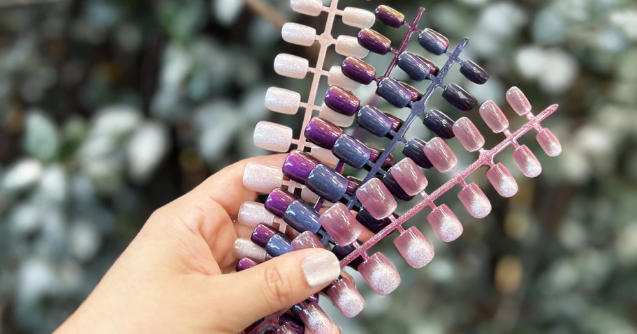 hand holding up multiple pairs of Jofay Press On Nails