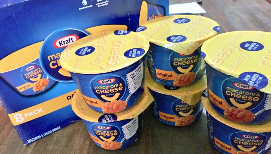 Kraft Mac & Cheese Cups stacked on table in front of their box