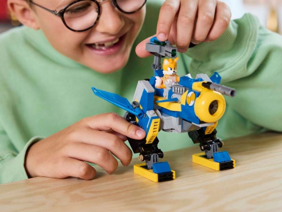 kid playing with LEGO Cyclone vs. Metal Sonic