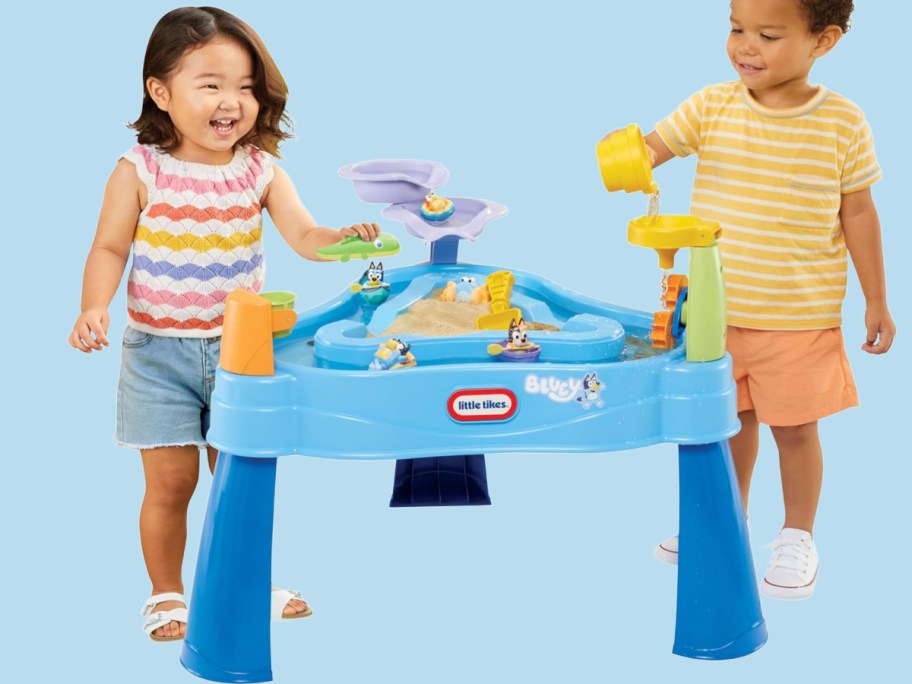 A girl and boy toddler playing with a little tikes, Bluey water tabl