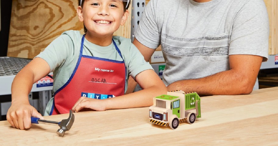 little boy building Lowes Recycling Truck