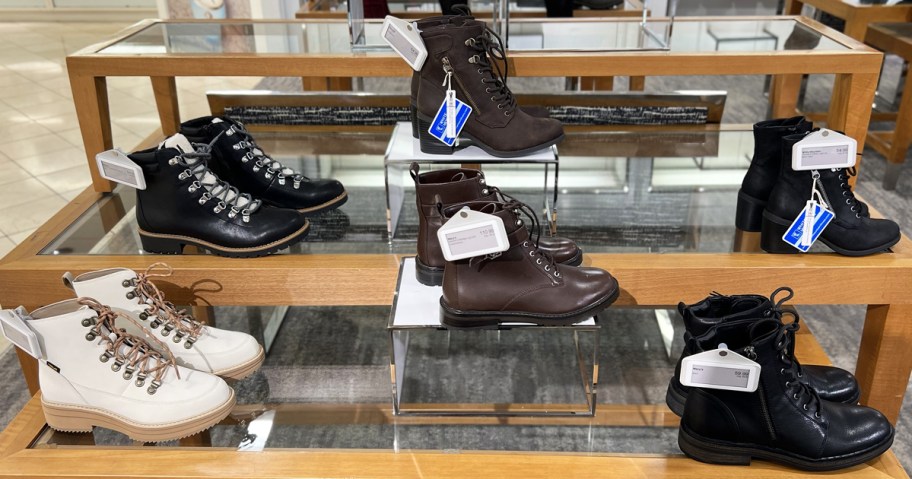 boots on a display table in macy's store