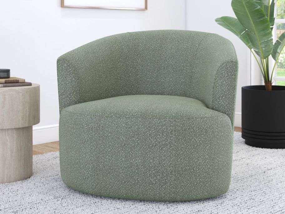 A green swivel chair in a living room 