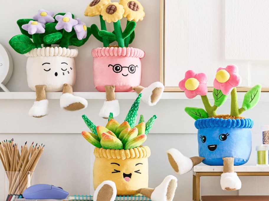 four potted plant plushies with flowers